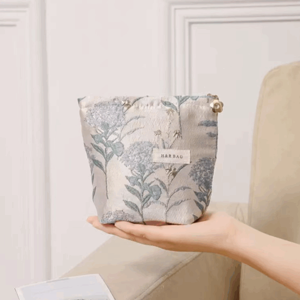 small blue cosmetic bag