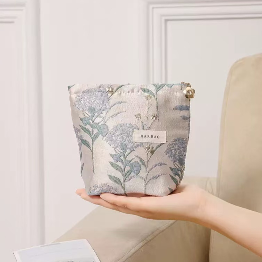 small blue cosmetic bag